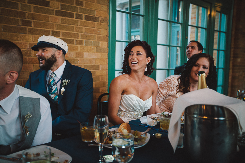 55 at the table laughing at chicago wedding - Wedding Photographer in Chicago // Jessica + Aaron