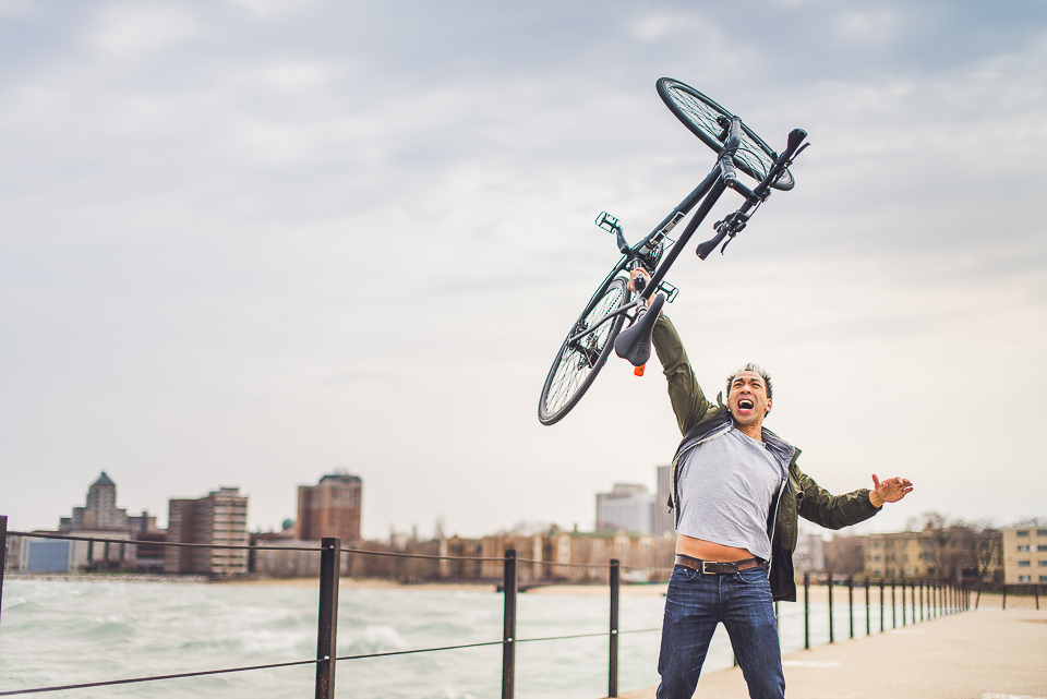 07 strong man picking up bike - Best Photos of 2014 // Chicago Wedding Photographer