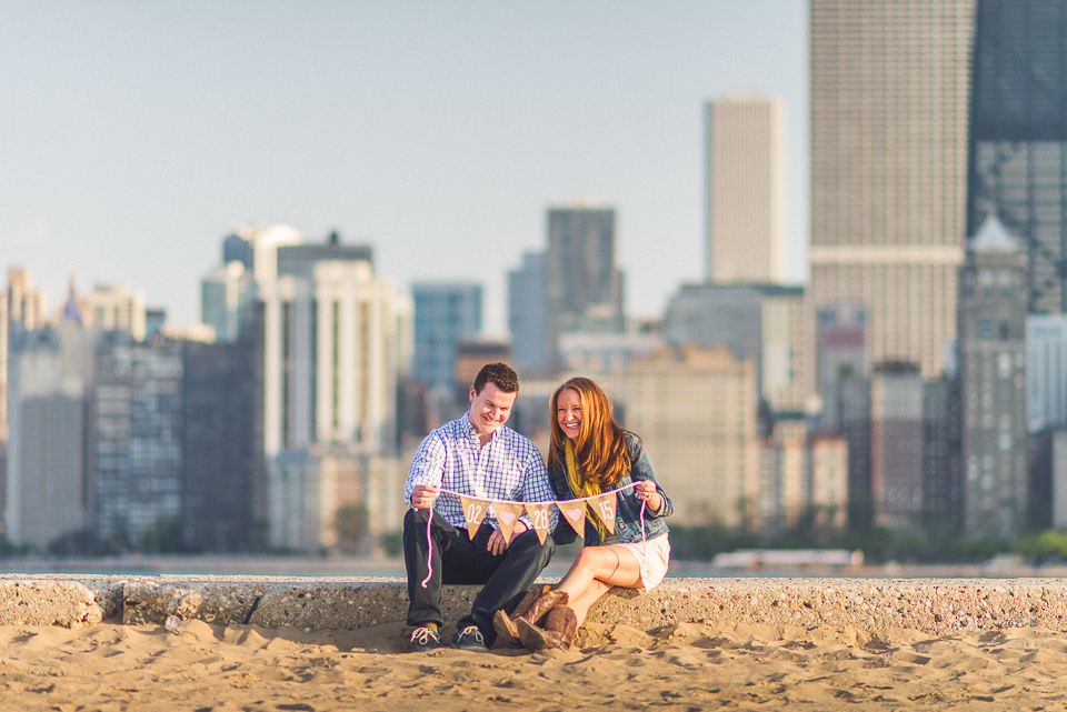 08 couple laughing while sitting - Amy + Pat // Chicago Engagement Photography
