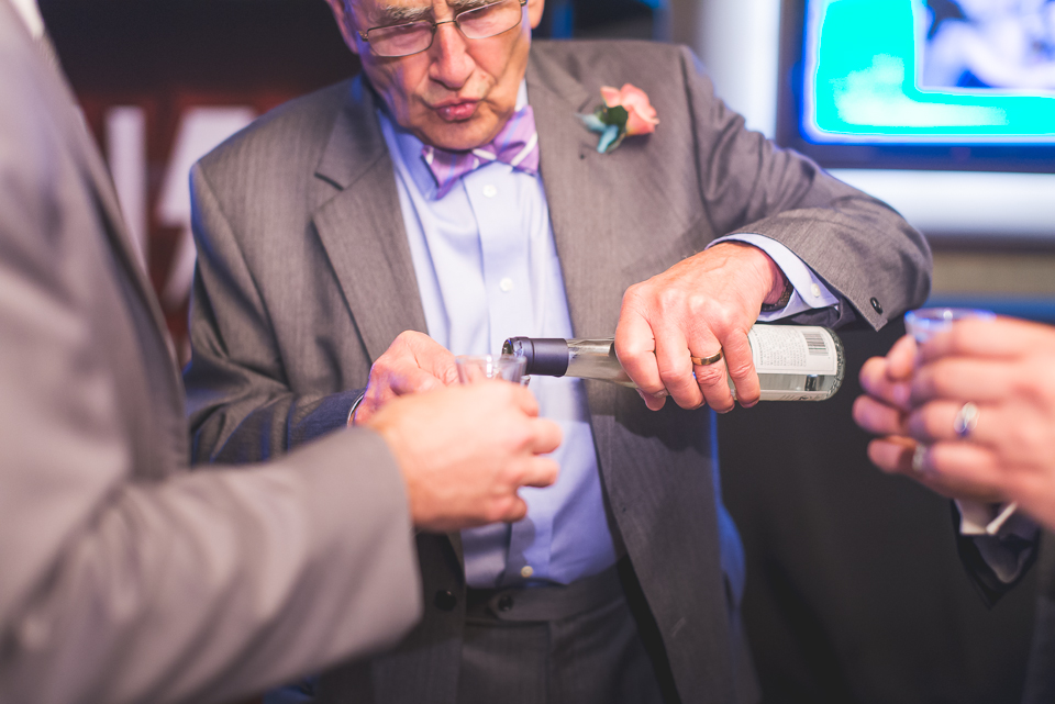 53 pouring slivovica - Best Photos of 2014 // Chicago Wedding Photographer