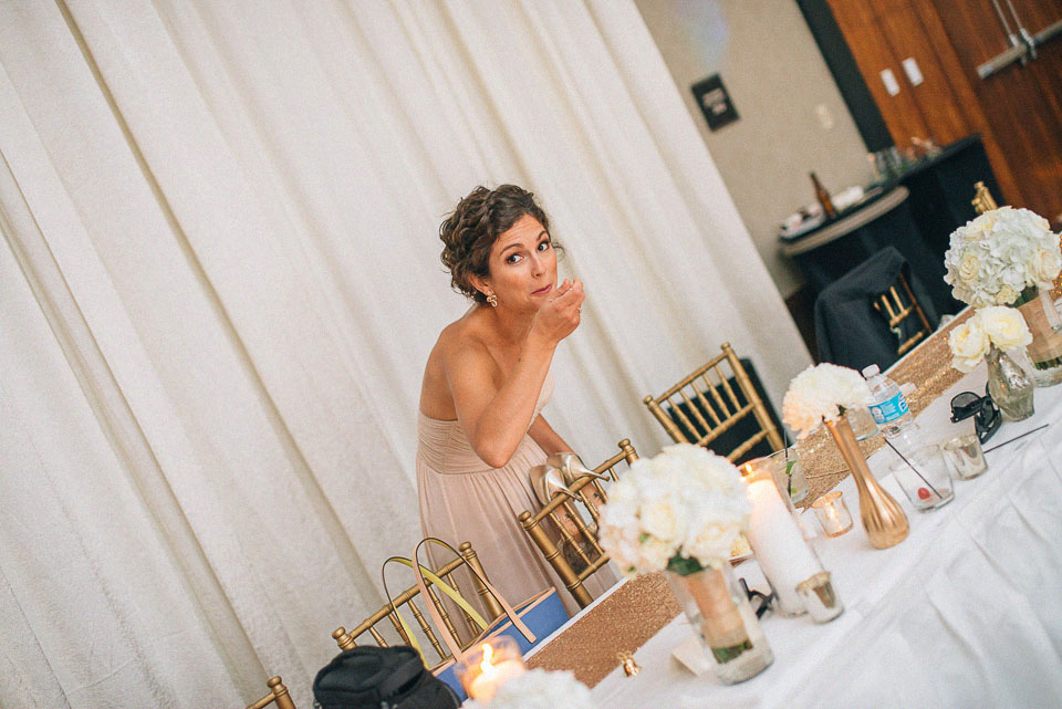 44 bridesmaid sneaking food - Omaha Wedding Photography // Andy + Nicole
