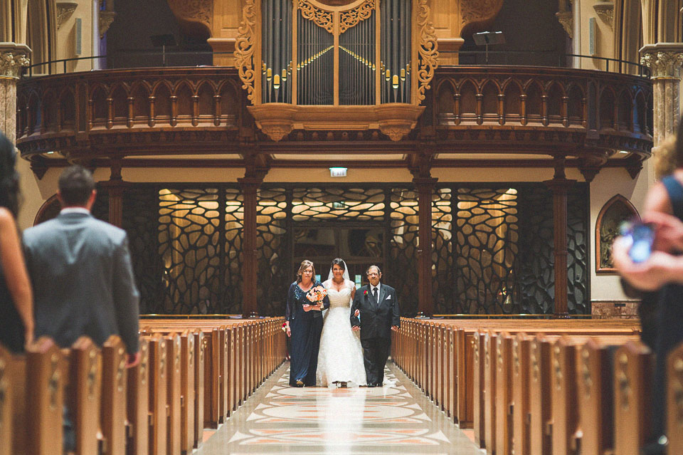 19 walking with parens down the isle - Holy Name Cathedral // Chicago Wedding Venue