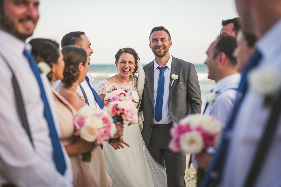 65 bride and groom with party - Kindal + Mike's Cancun Mexico Wedding