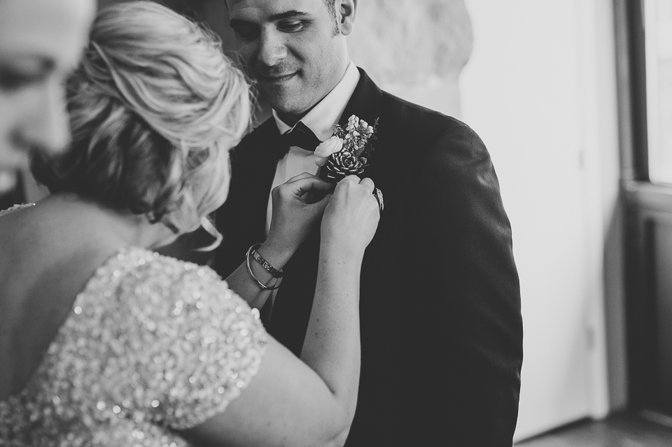 10 pinning flowers on groom - Pam + Vinny // Chicago Wedding Photographer
