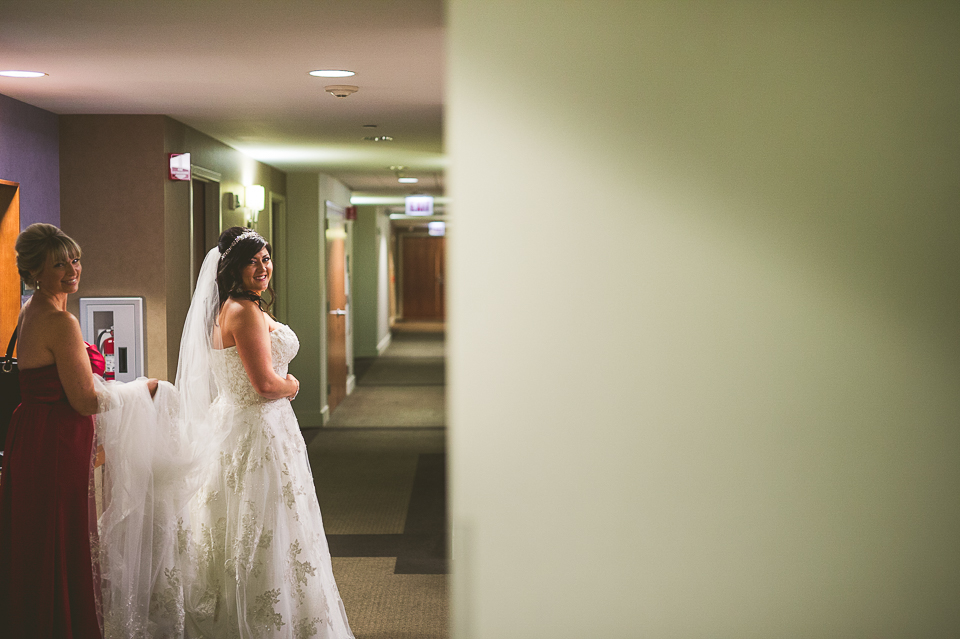 15 bride in the hallway - Tami + Matt // Chicago Wedding Photographer