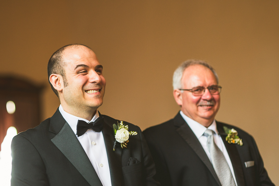 21 groom waiting at alter - Pam + Vinny // Chicago Wedding Photographer