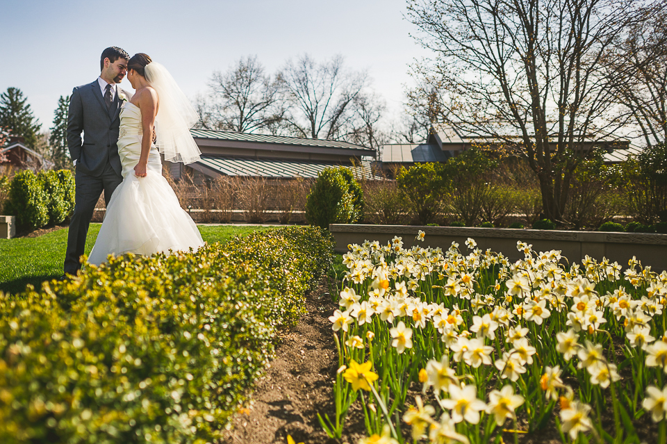 32 bride and groom by flowers - Mandy + Brian // Chicago Wedding Photographer
