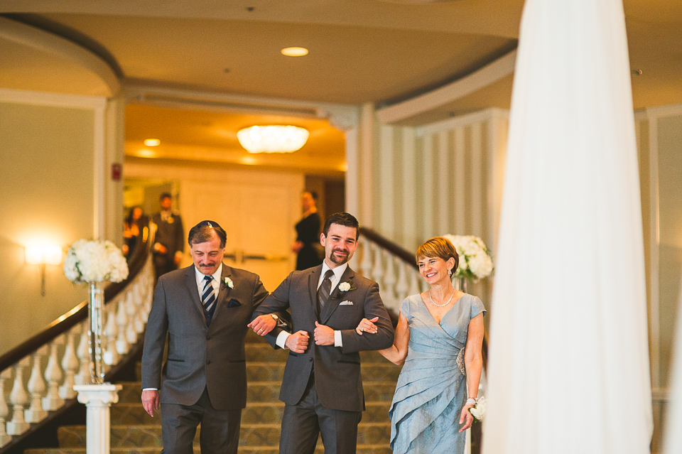 41 groom escorted by parents - Mandy + Brian // Chicago Wedding Photographer