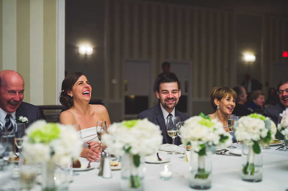 57 bride laughing from speeches - Mandy + Brian // Chicago Wedding Photographer