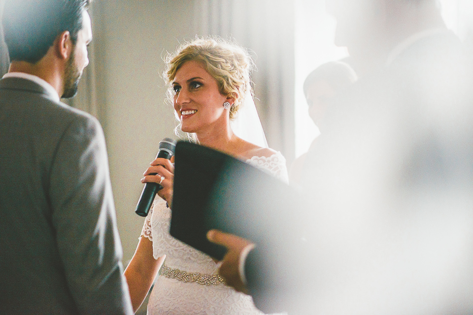 37 bride on the microphone durinv vows - Jay + Callie // Downtown Chicago Wedding Photographer