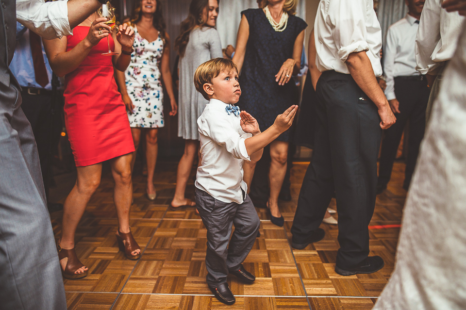59 kid doing kung fu at reception - Jay + Callie // Downtown Chicago Wedding Photographer