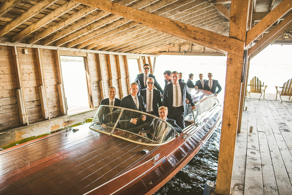 36 groom in a boat - Mandy + Mike // Stouts Island Lodge Wedding Photographers