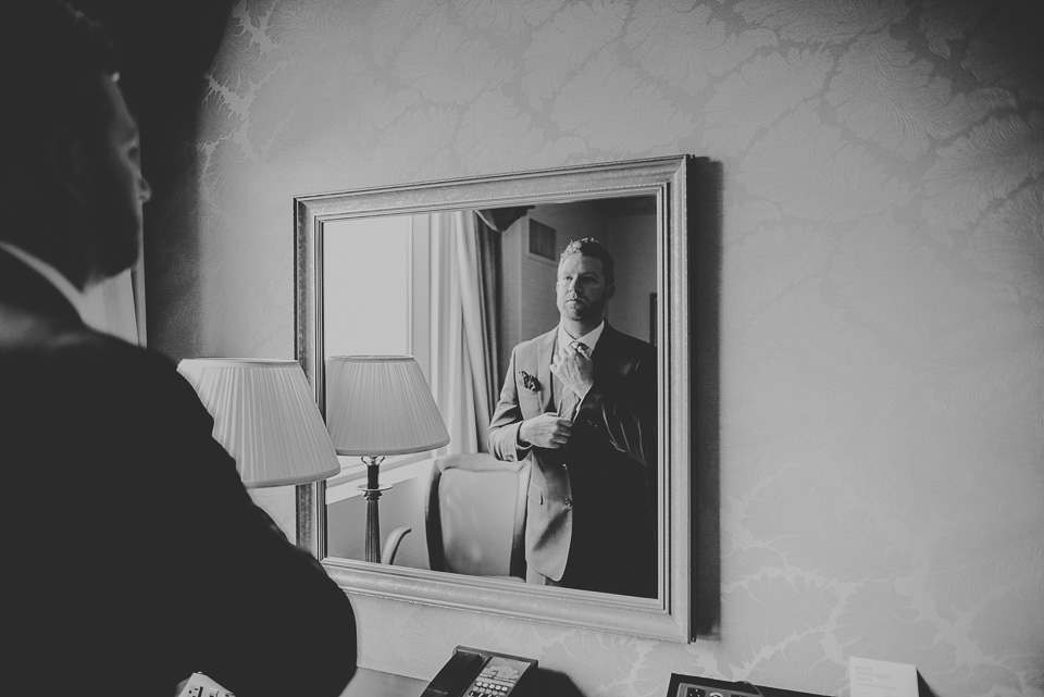 14 black and white groom in mirror - Lindsey + Jack // Chicago Suburb Wedding Photography