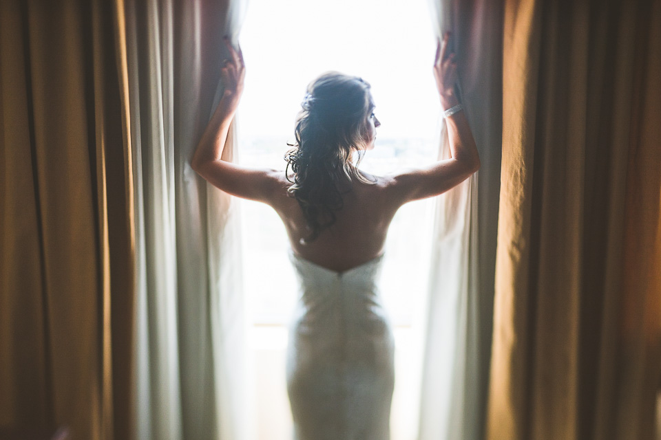 18 bride by window - Lindsey + Jack // Chicago Suburb Wedding Photography