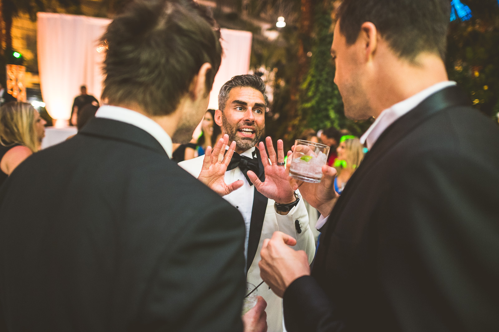 118 groom talking - Marisa + Chris // Chicago Wedding Photos at Navy Pier Crystal Garden