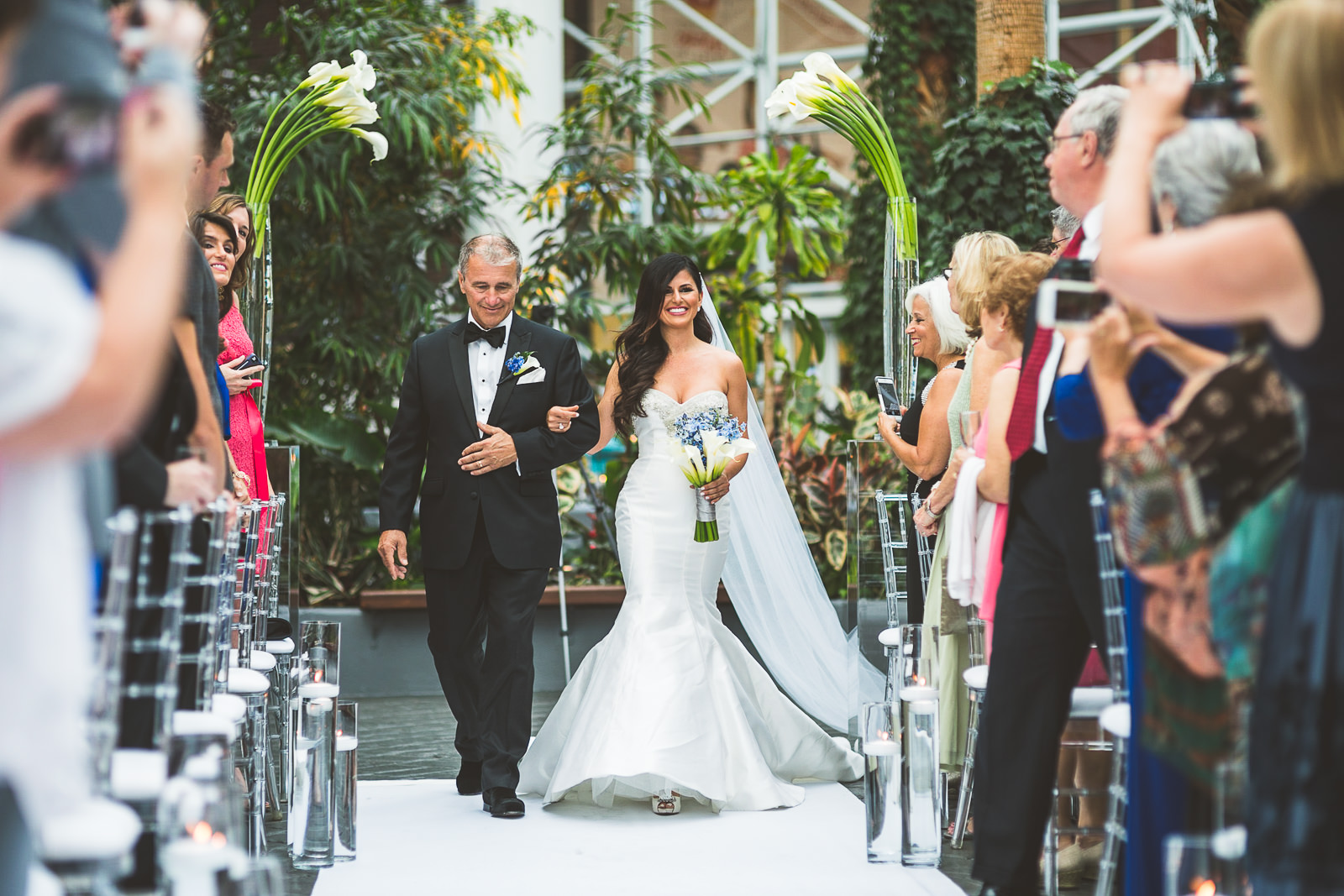 46 bride walking down the isle - Marisa + Chris // Chicago Wedding Photos at Navy Pier Crystal Garden
