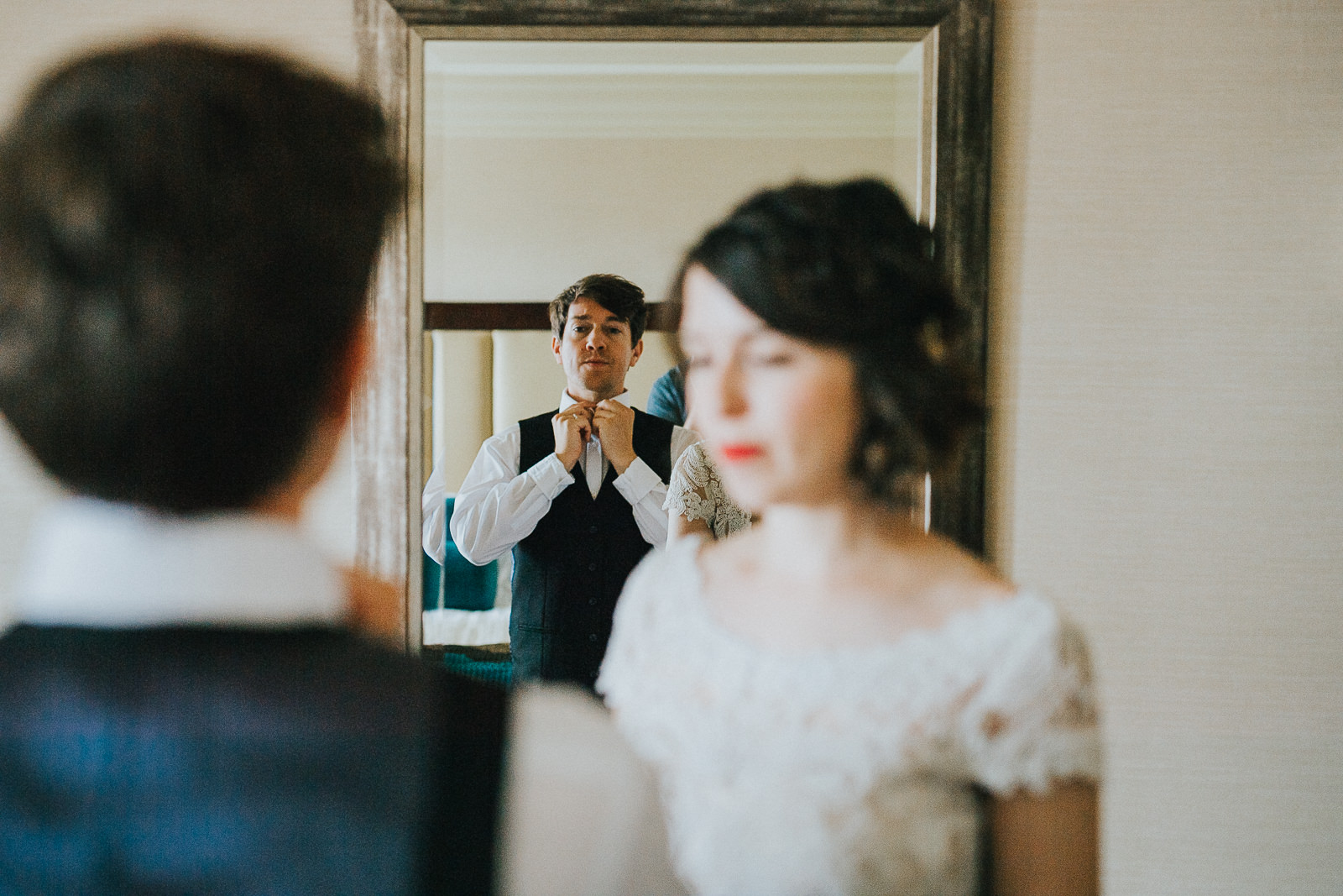10 groom in mirror - Megan + Jon // Orpheum Wedding Photography in Madison