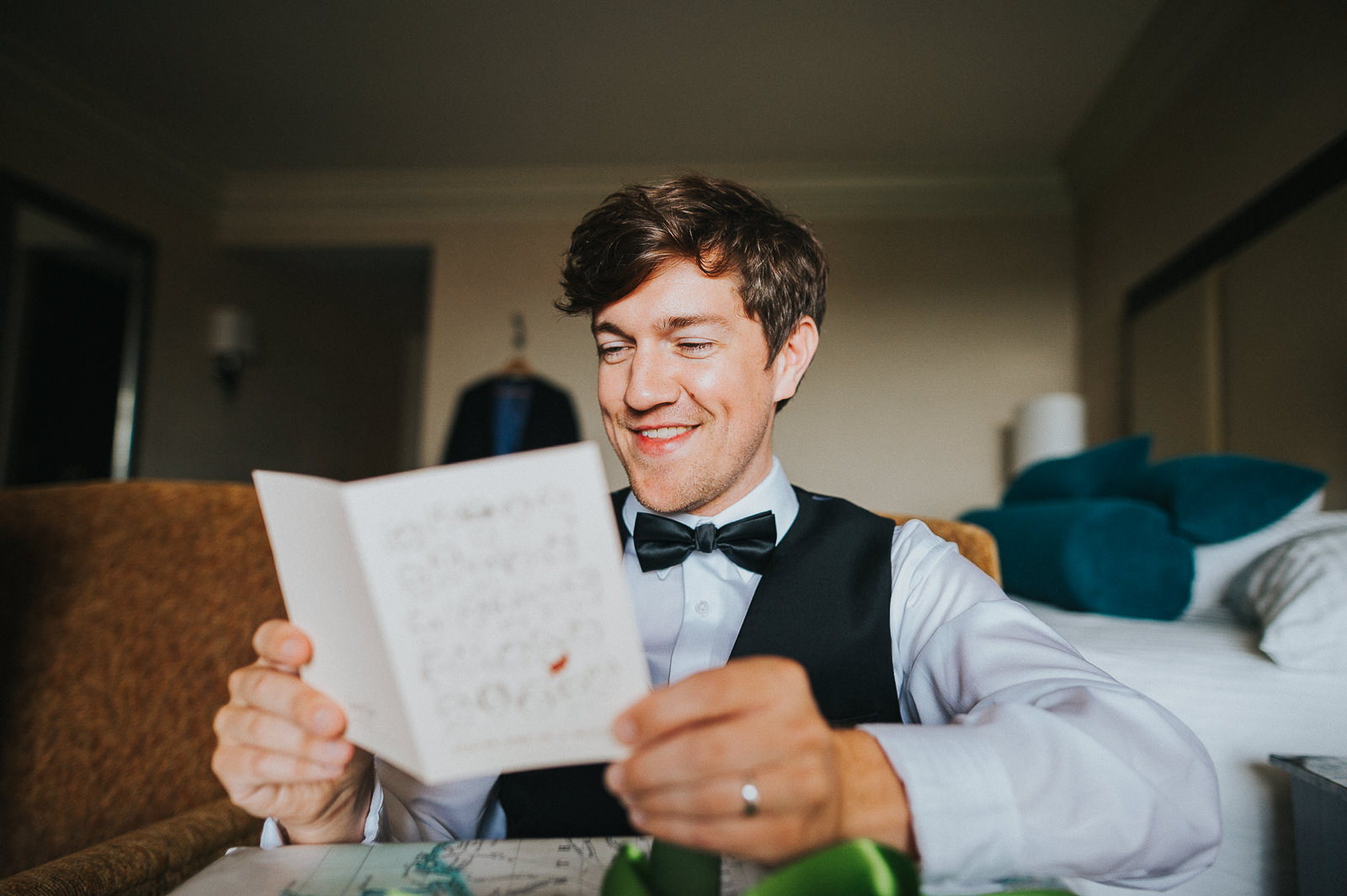 22 groom reading card - Megan + Jon // Orpheum Wedding Photography in Madison