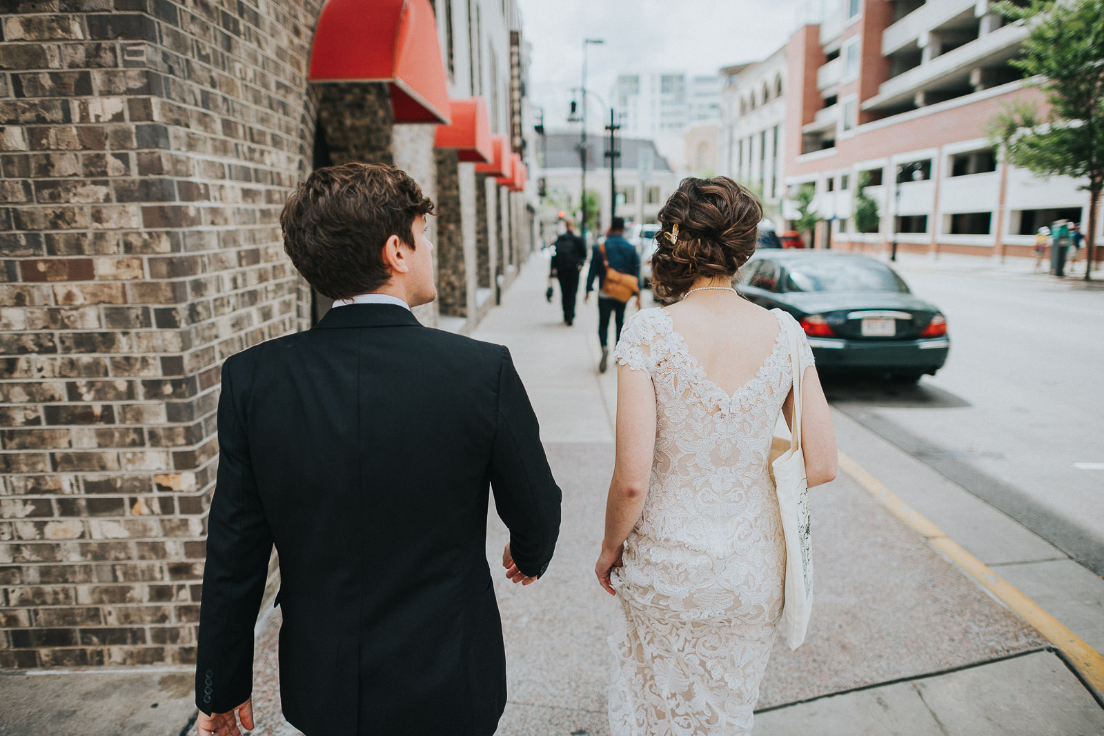26 1 bride and groom walking - Megan + Jon // Orpheum Wedding Photography in Madison