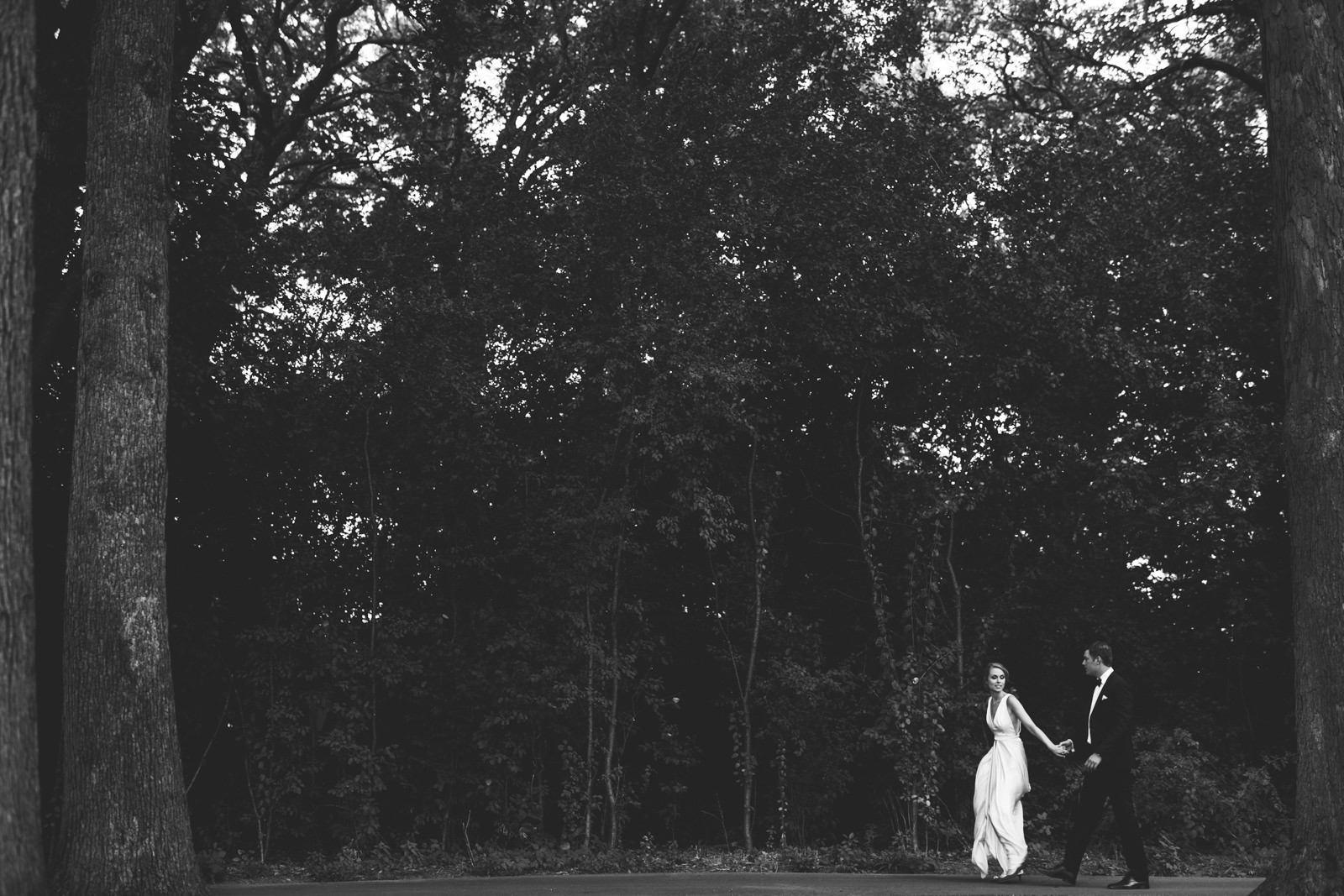 51 black and white bride and groom walking - Stephanie + Zack // Conway Farms Chicago Wedding Photographers