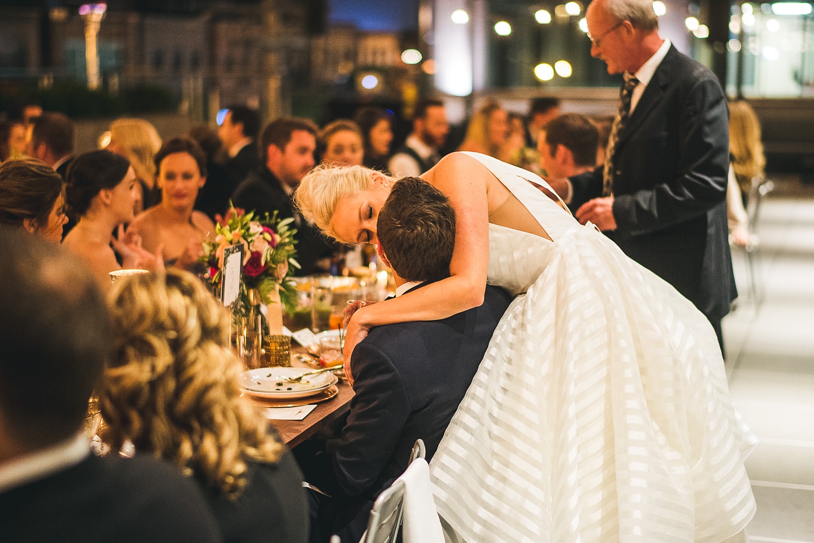 58 bride kisses groom at table - Morgan's on Fulton Wedding Photos // Jessica + Bill