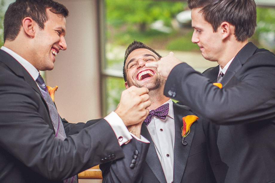 07 best men playing around with groom  chicago wedding photographer