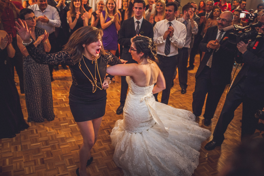 31 bride and friend dancing  chicago wedding photographer