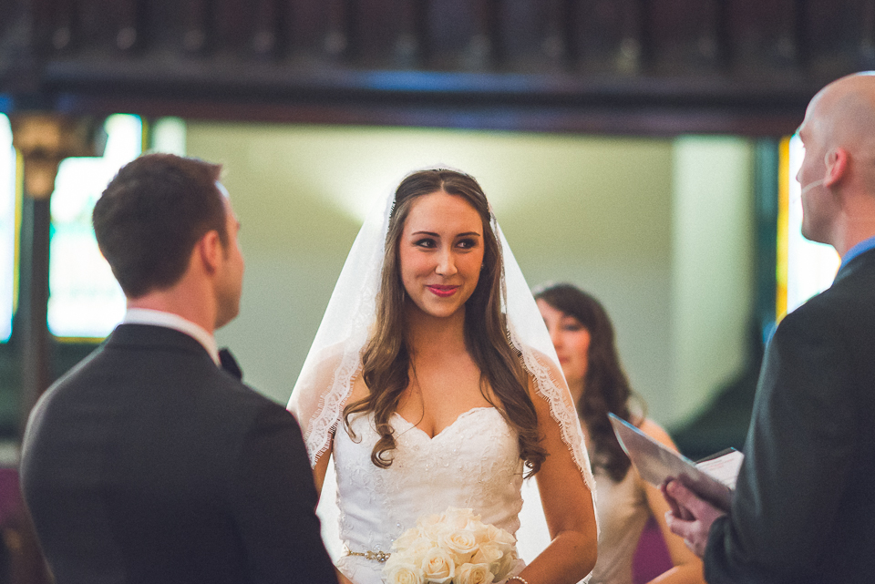 32 bride and groom at the alter