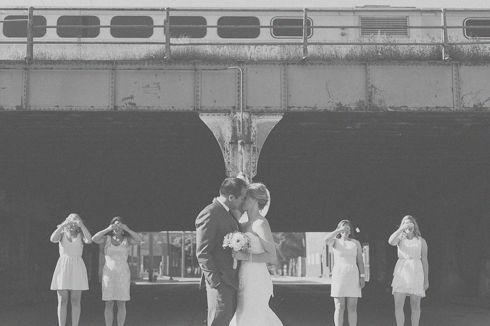 23 bride and groom kissing by train in chicago