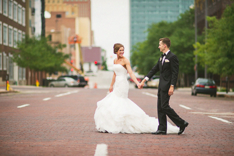 36 bride and groom crossing the street in old market omaha
