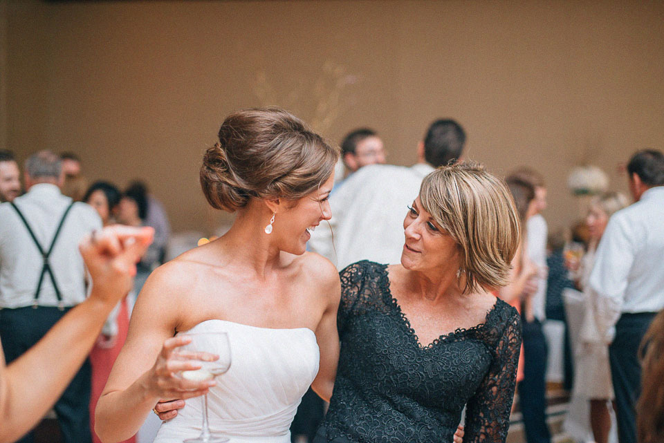 57 bride and mom dancing