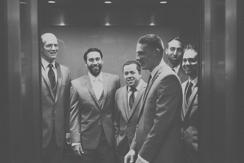 14 groomsmen in the elevator