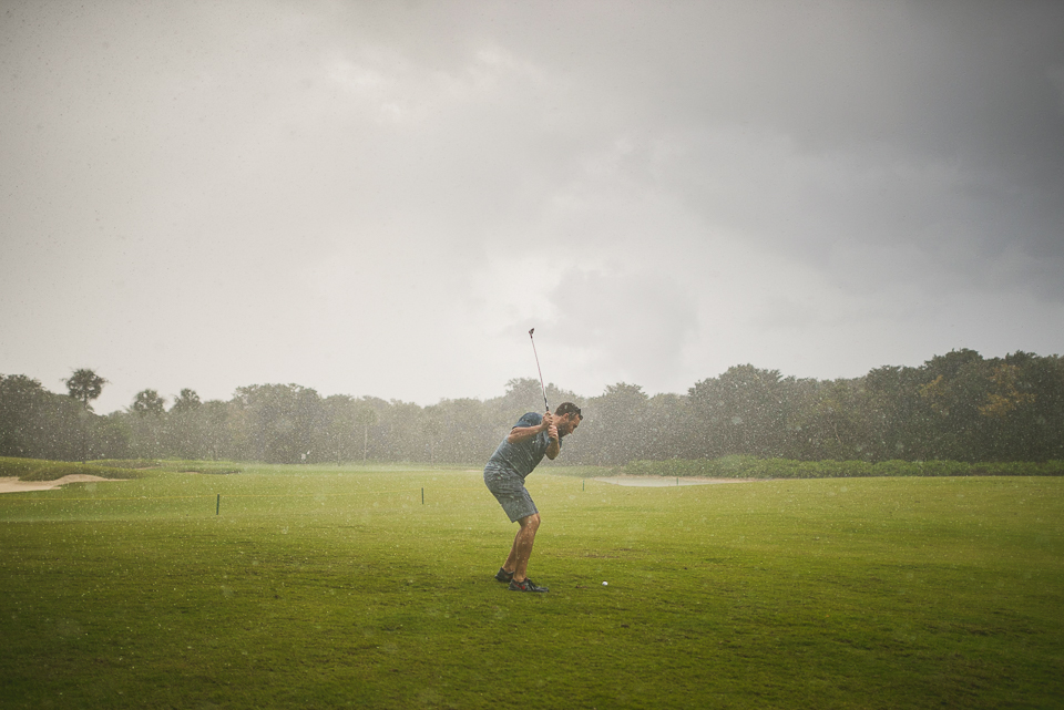 14 groom golfing while raining
