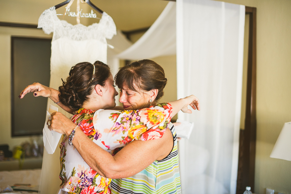 19 bride and mom hugging