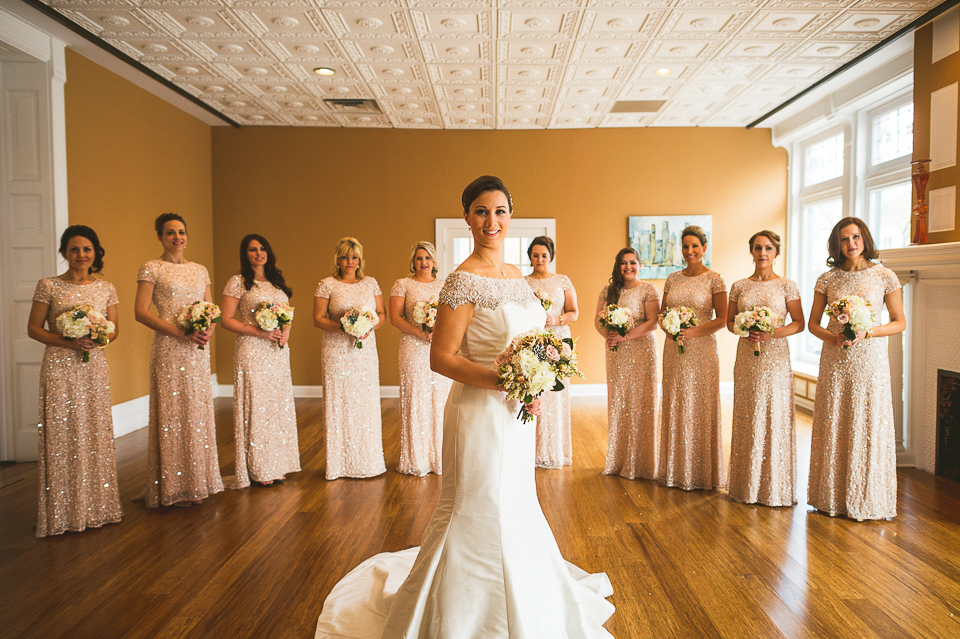 11 bride and bridesmaids posed
