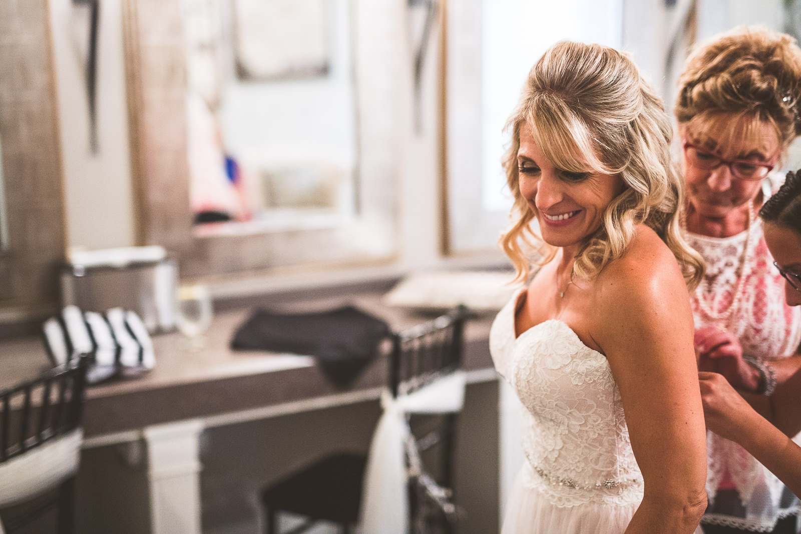 08 bride putting dress on