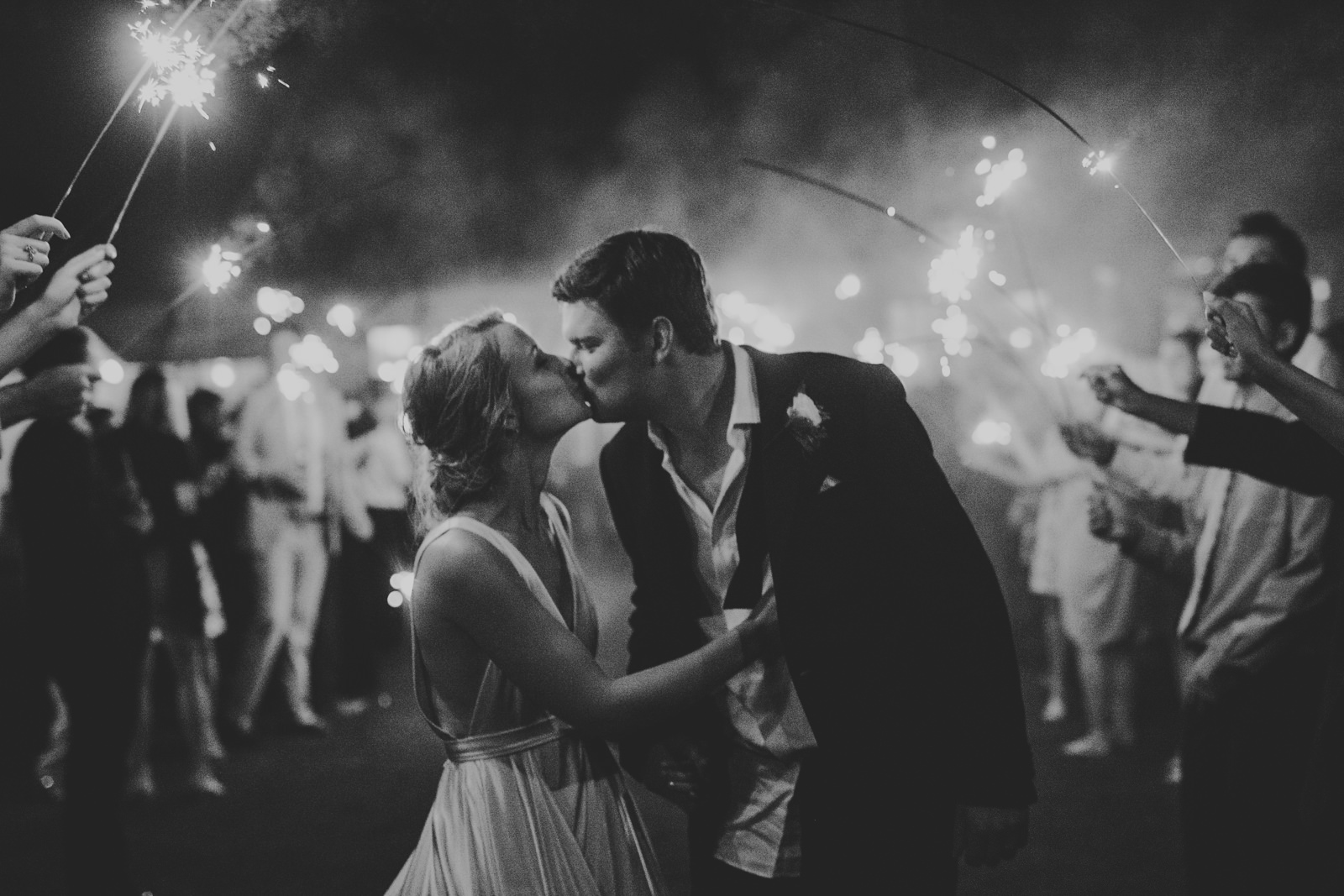 106-bride-and-groom-kiss-at-sparkler-exit